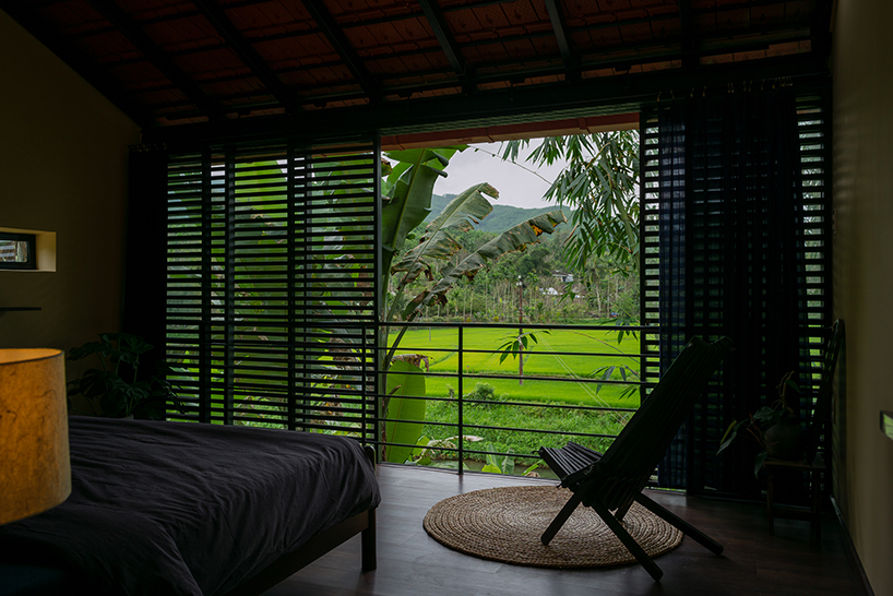 overlapping shingle roofs shield multileveled tien cam house in vietnam