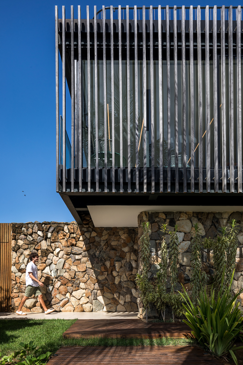 permeable wooden cladding merges boutique hotel with nature on brazilian island