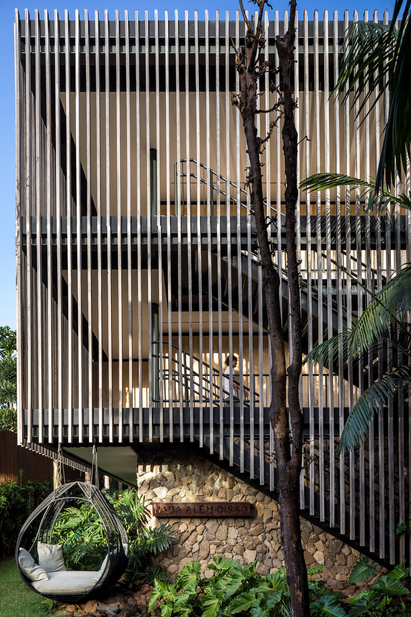permeable wooden cladding merges boutique hotel with nature on brazilian island