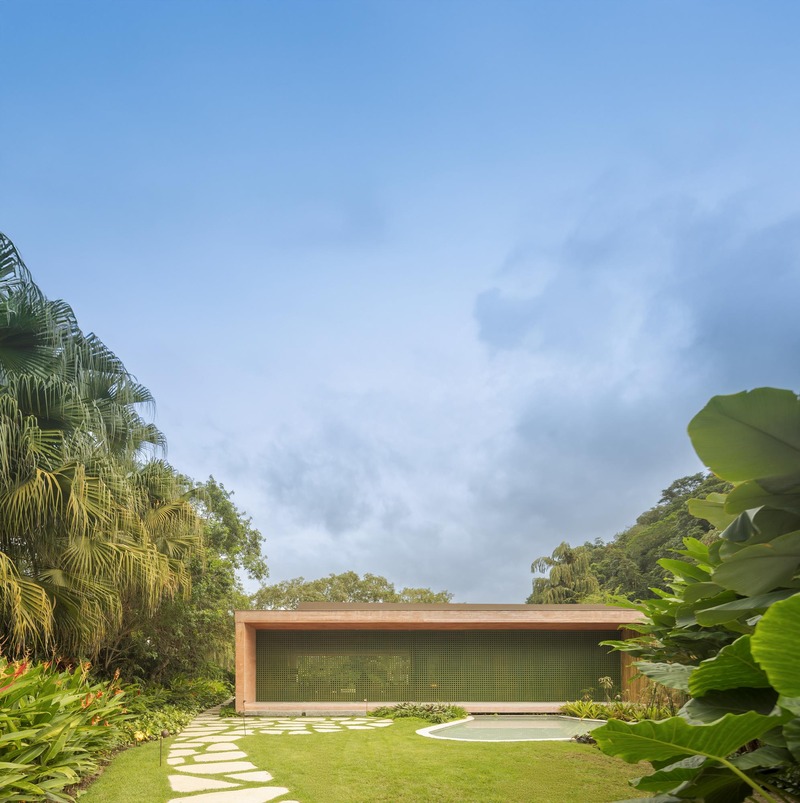 MF+Arquitettos' dry pink concrete residence emerges from Rio de Janeiro's lush jungle