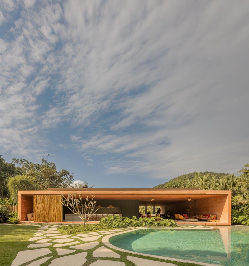 MF+Arquitettos' dry pink concrete residence emerges from Rio de Janeiro's lush jungle