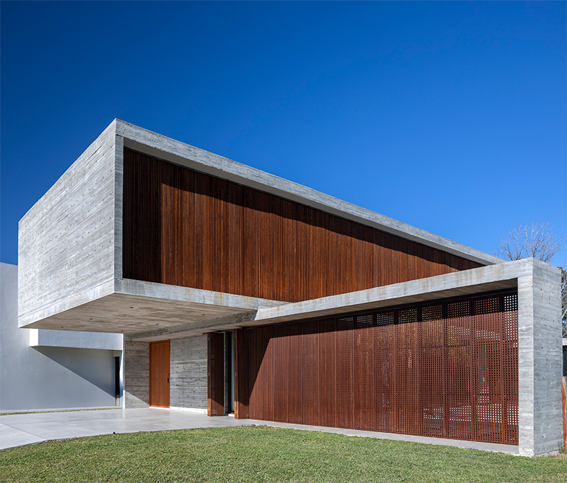 TIM arquitectos combines concrete and corten steel for casa guayubira in buenos aires