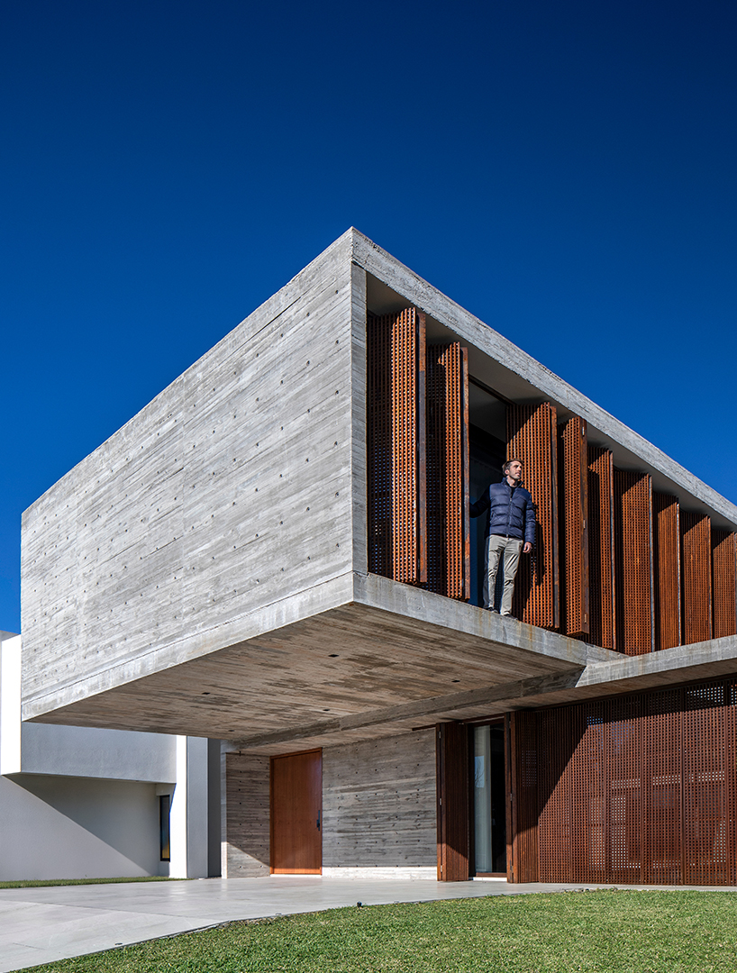 TIM arquitectos combines concrete and corten steel for casa guayubira in buenos aires