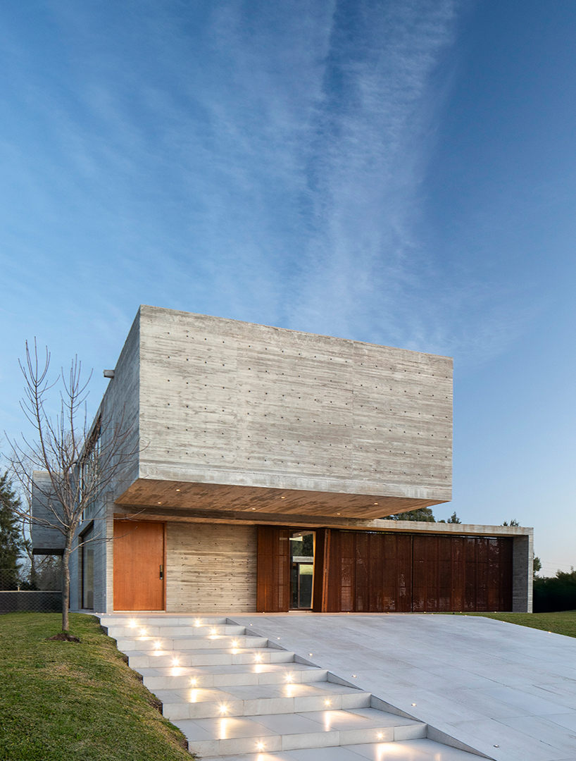 TIM arquitectos combines concrete and corten steel for casa guayubira in buenos aires
