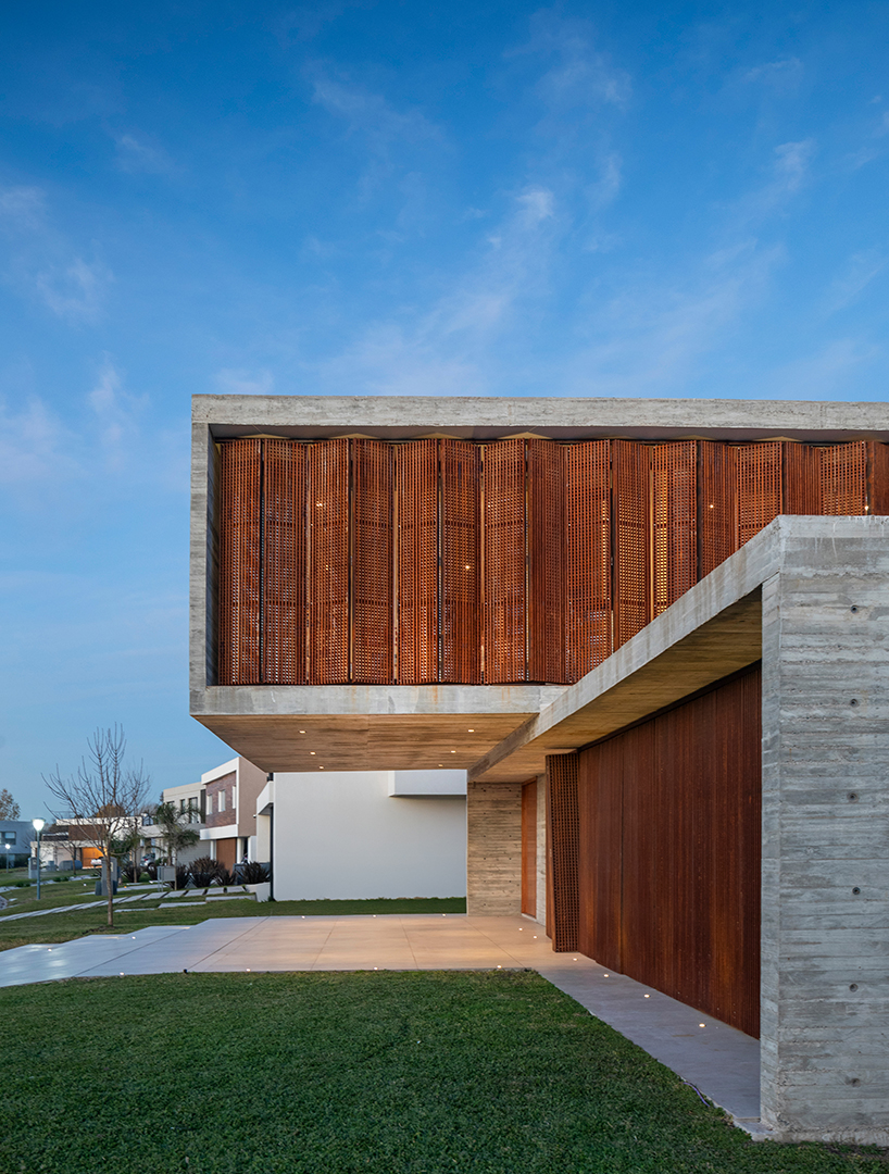 TIM arquitectos combines concrete and corten steel for casa guayubira in buenos aires