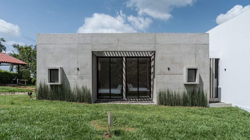 concrete residence expands cantilevered volumes in rural colombia