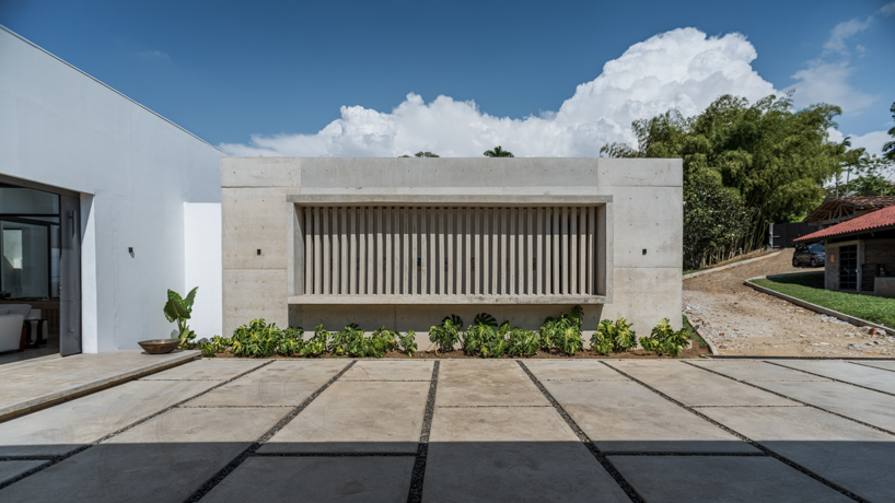 concrete residence expands cantilevered volumes in rural colombia