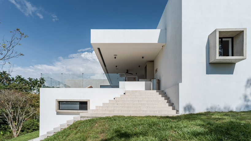 concrete residence expands cantilevered volumes in rural colombia