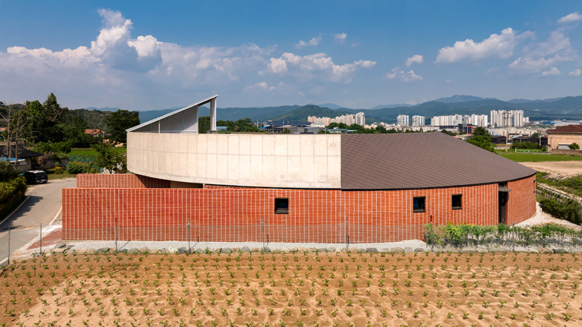 circular house by sukchulmok + BRBB encloses vegetable garden on korean farmland