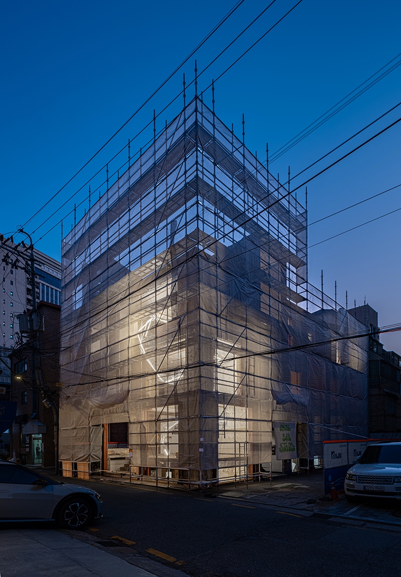 sculptures made of timber and steel occupy raw concrete shell in seoul before demolition - 12