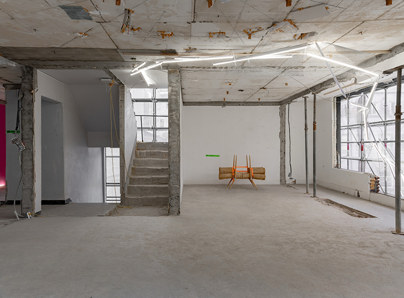 sculptures made of timber and steel occupy raw concrete shell in seoul before demolition - 5