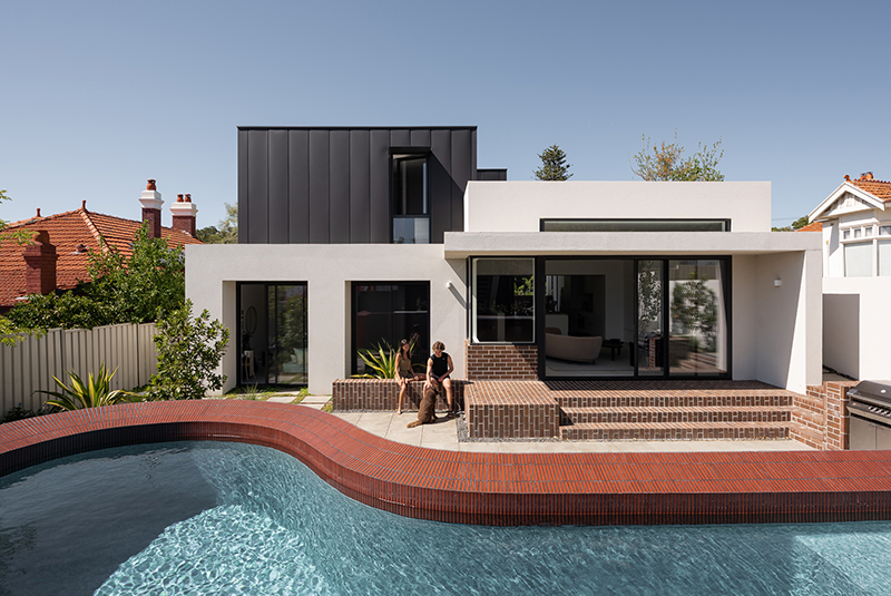 red brickwork and bone-colored walls compose hyde park house's facade in australia