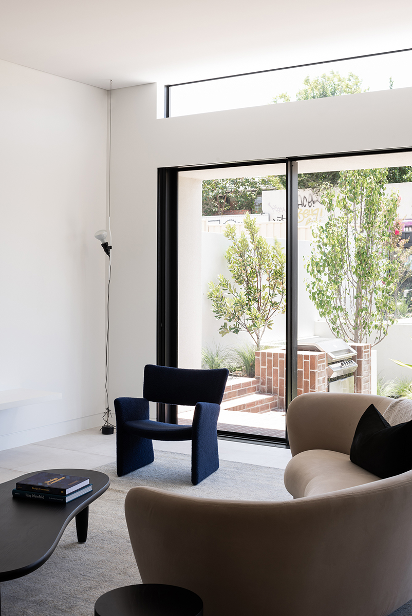 red brickwork and bone-colored walls compose hyde park house's facade in australia