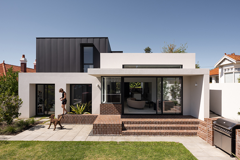 red brickwork and bone-colored walls compose hyde park house's facade in australia