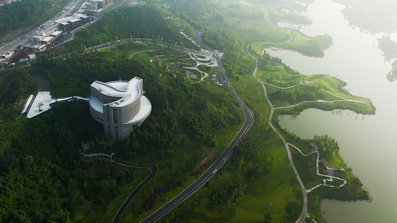 organic river forms prompt the design of tanghua architects' exhibition center in china