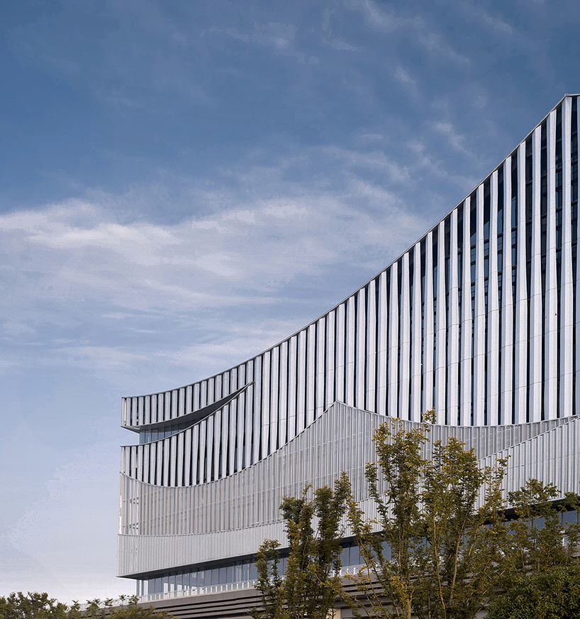 changsha conference center's facade by SCAD employs perforated metal panels