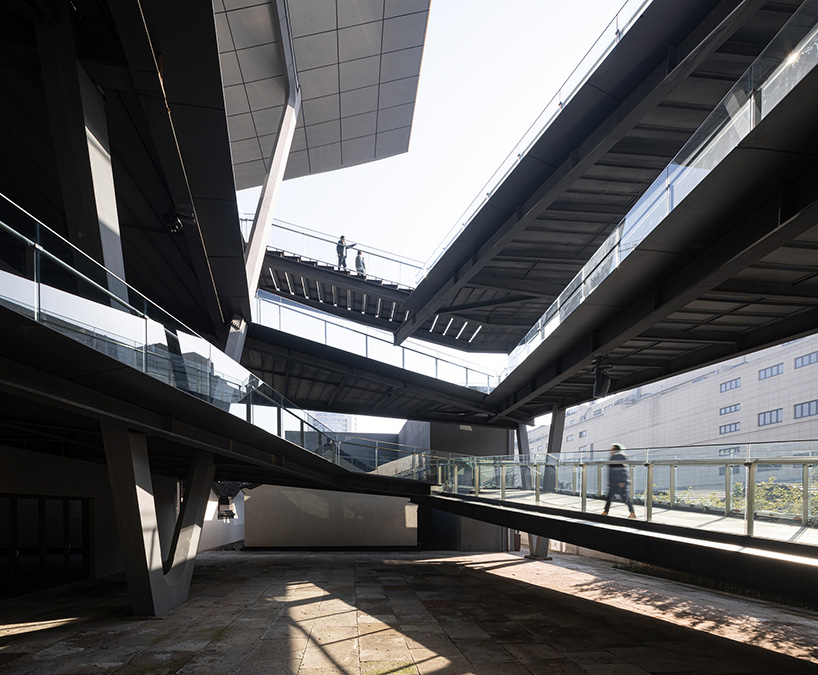 cascading planes and platforms encircle spActrum’s stellar isle center in chinese old town