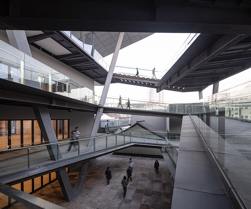 cascading planes and platforms encircle spActrum’s stellar isle center in chinese old town