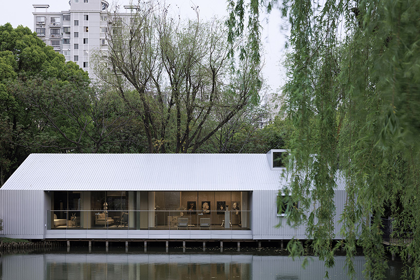 wutopia lab's prefabricated waterfront house in shanghai wraps in aluminum and ceramic skin
