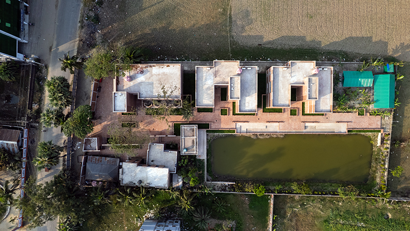 brick walls and perforated jali screens enclose training hub by codec in coastal bangladesh