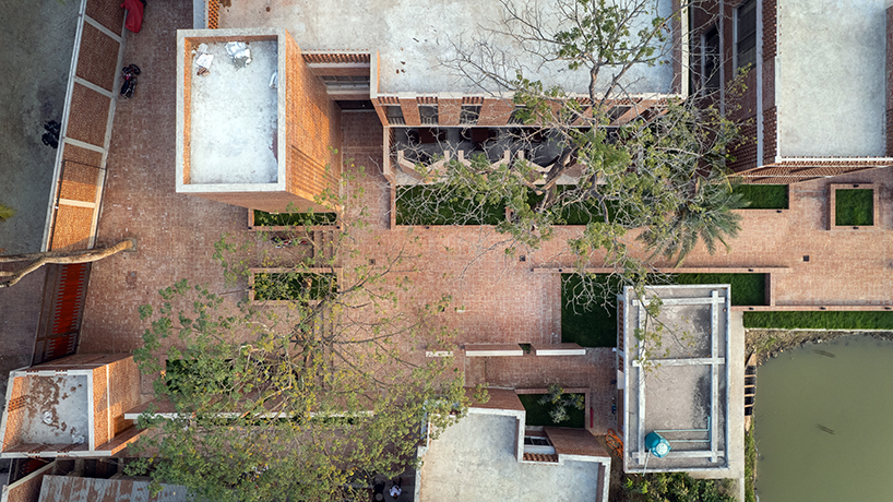 brick walls and perforated jali screens enclose training hub by codec in coastal bangladesh