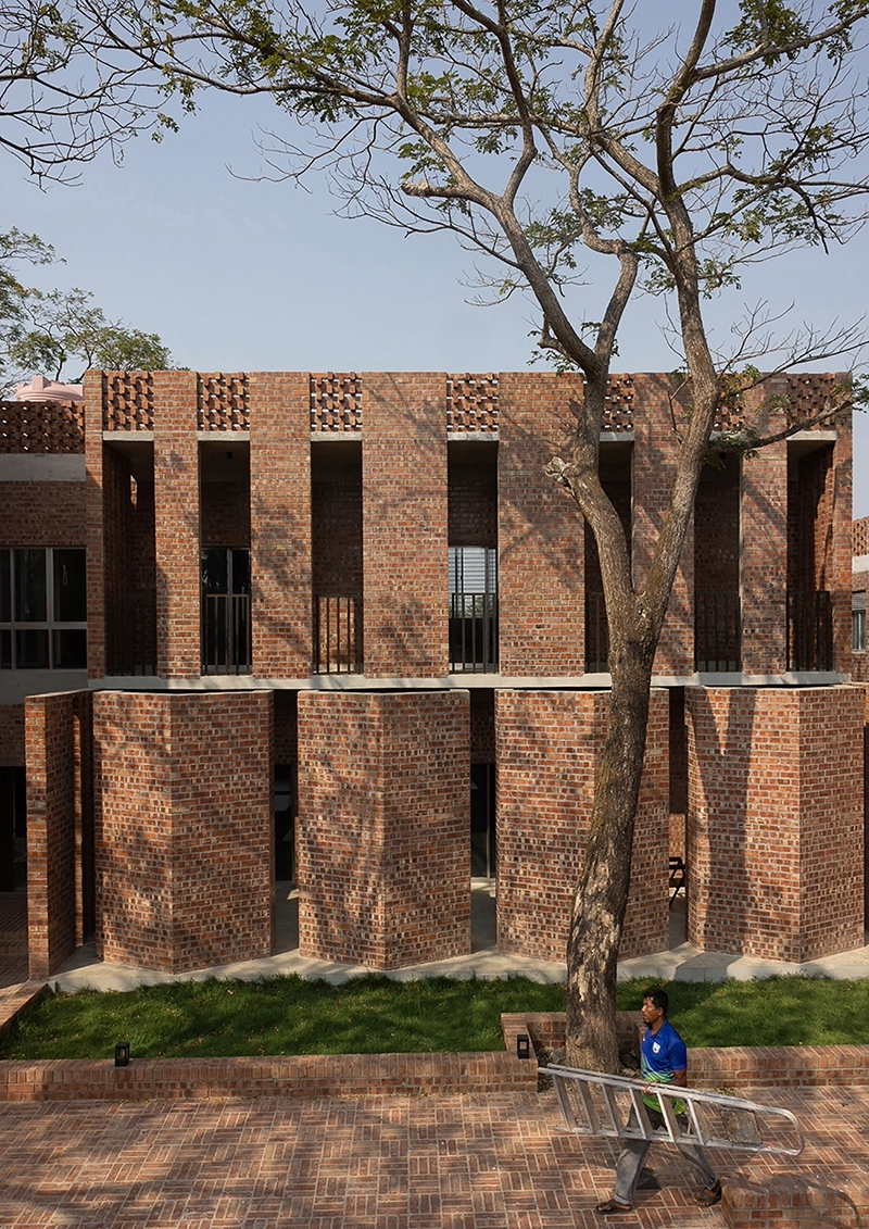 brick walls and perforated jali screens enclose training hub by codec in coastal bangladesh