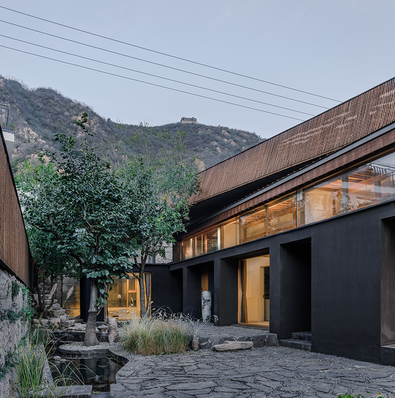 bending wooden bridge by DL atelier hovers above historical chinese fortress