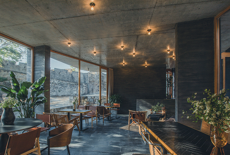 bending wooden bridge by DL atelier hovers above historical chinese fortress