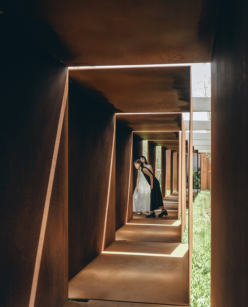 rhythmic steel pavilion by DL atelier weaves through riverfront bamboo grove in china