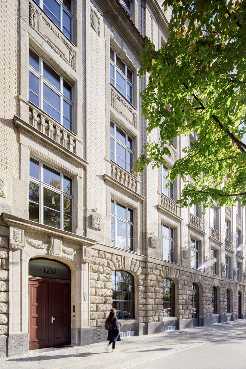 club marginal's renovation preserves the layers of time on historic office building in germany