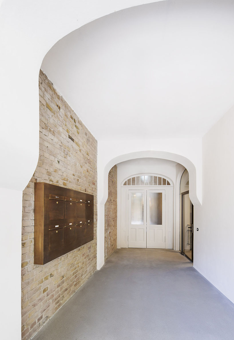 club marginal's renovation preserves the layers of time on historic office building in germany