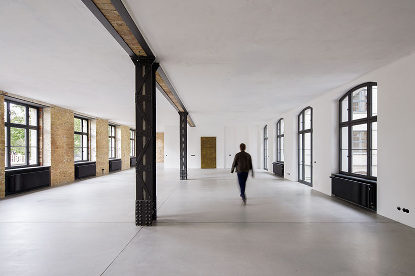 club marginal's renovation preserves the layers of time on historic office building in germany
