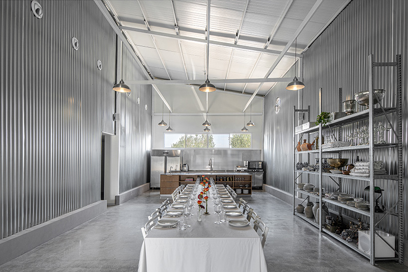 corrugated metal interiors reinvent vegetable storage fridge into industrial hospitality space