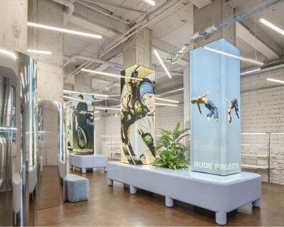 el departamento converts hangar into dystopian-inspired nude project store in bilbao