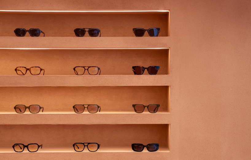 monochromatic terracotta interiors by el departamento adorn new optical boutique in spain