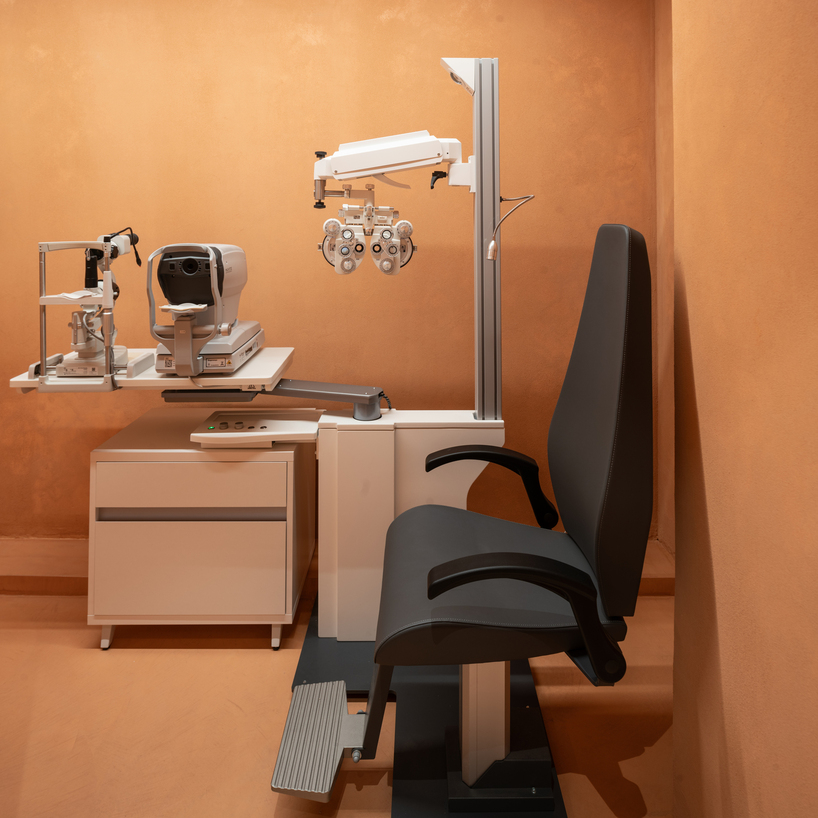 monochromatic terracotta interiors by el departamento adorn new optical boutique in spain