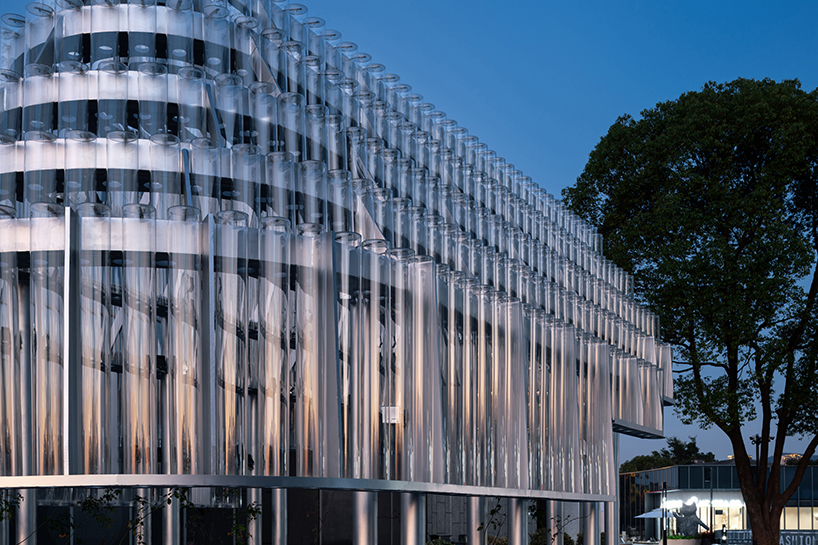 five stacks of glass tubes construct arc-shaped pavilion lucida by deep origin lab in china