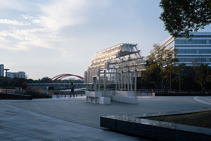 five stacks of glass tubes construct arc-shaped pavilion lucida by deep origin lab in china