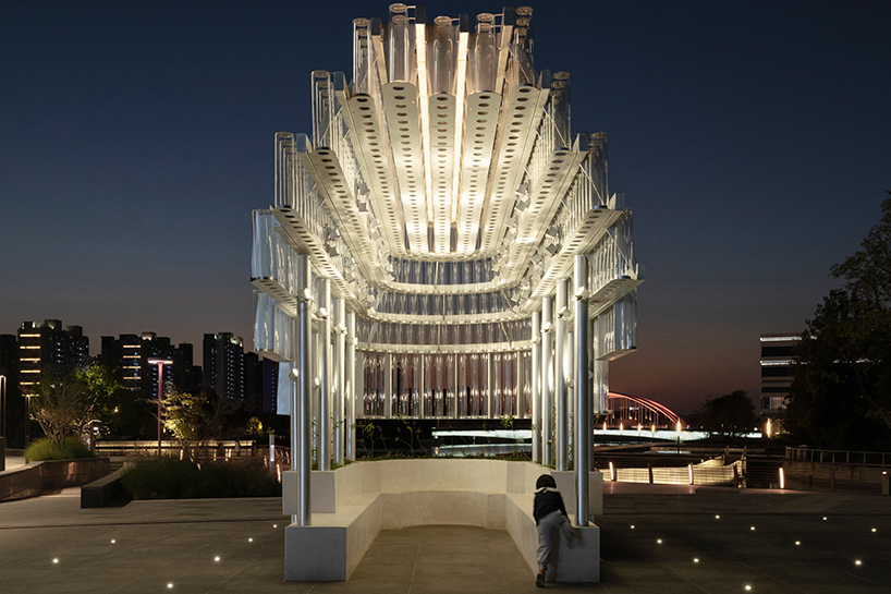 five stacks of glass tubes construct arc-shaped pavilion lucida by deep origin lab in china