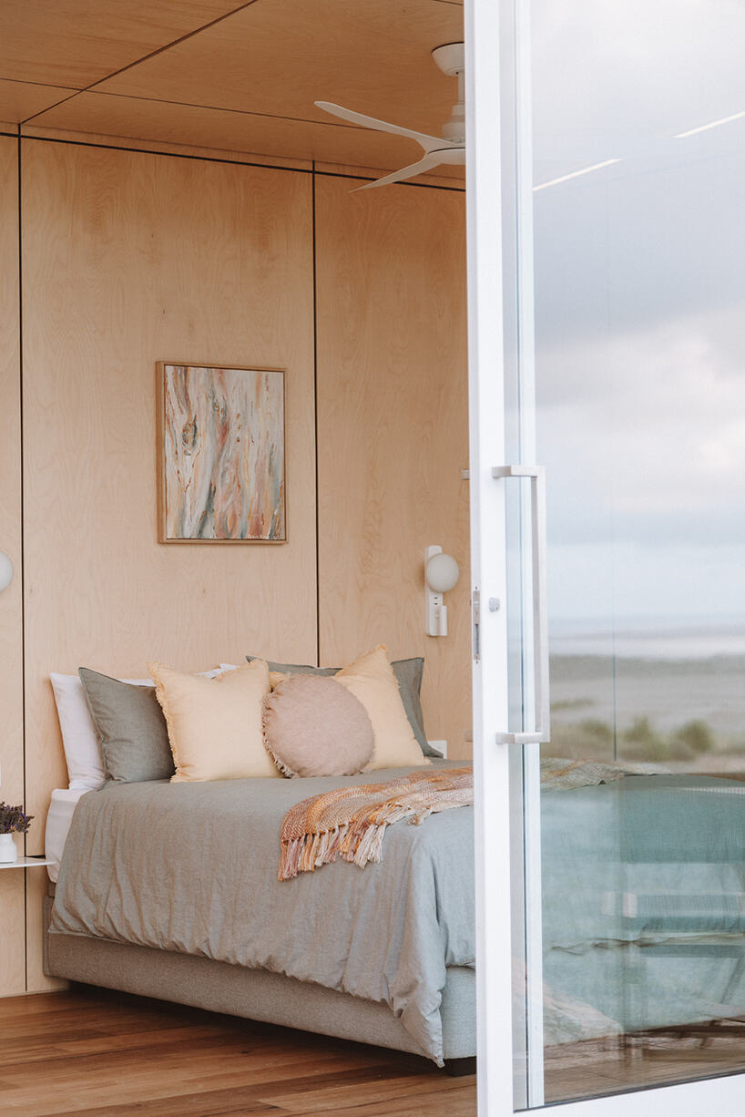 off-grid holiday pod fuses eco-conscious features with modern luxury in australia's west bay