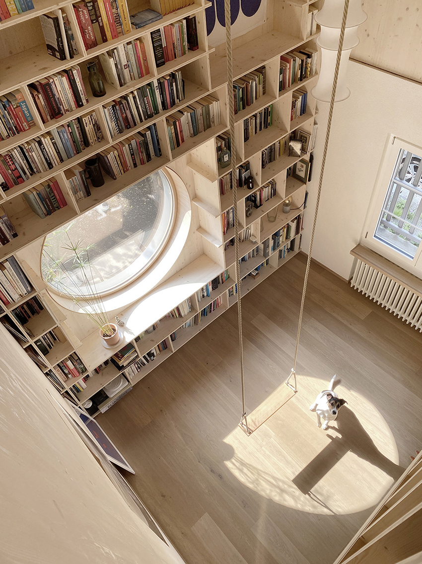 rounded openings and programmed 3D relief punctuate studio anna jach's wooden home extension in zurich