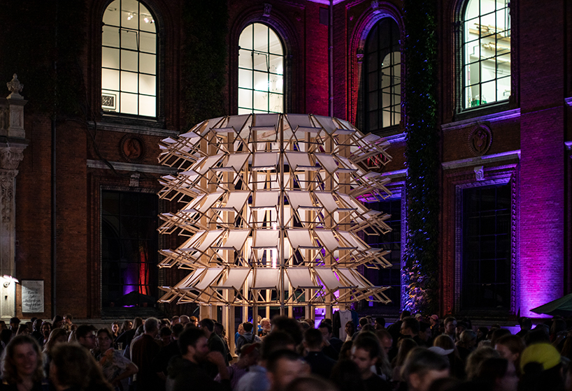 kinetic pavilion of wooden deck chairs by lasovsky johansson 'blooms' in copenhagen