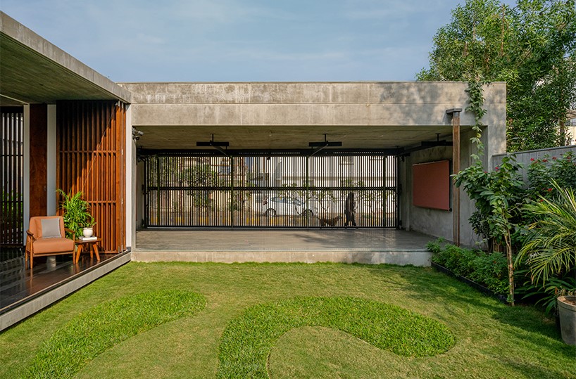 workspace in india showcases a material palette of wood, concrete, and kota stones