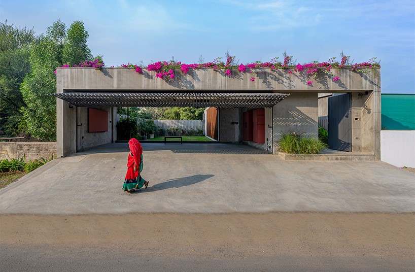 workspace in india showcases a material palette of wood, concrete, and kota stones