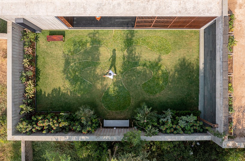 workspace in india showcases a material palette of wood, concrete, and kota stones