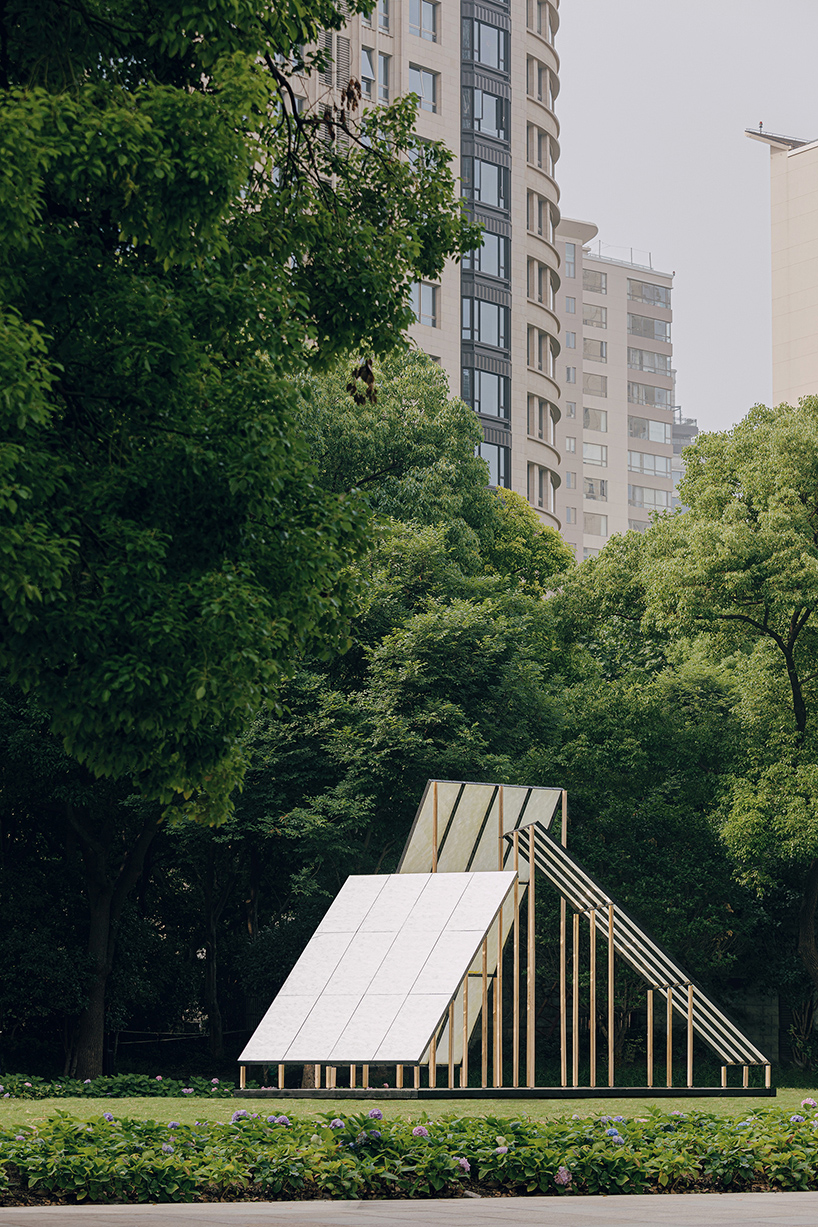 translucent panels of galaxy arch's installation cast warm glow across park in china