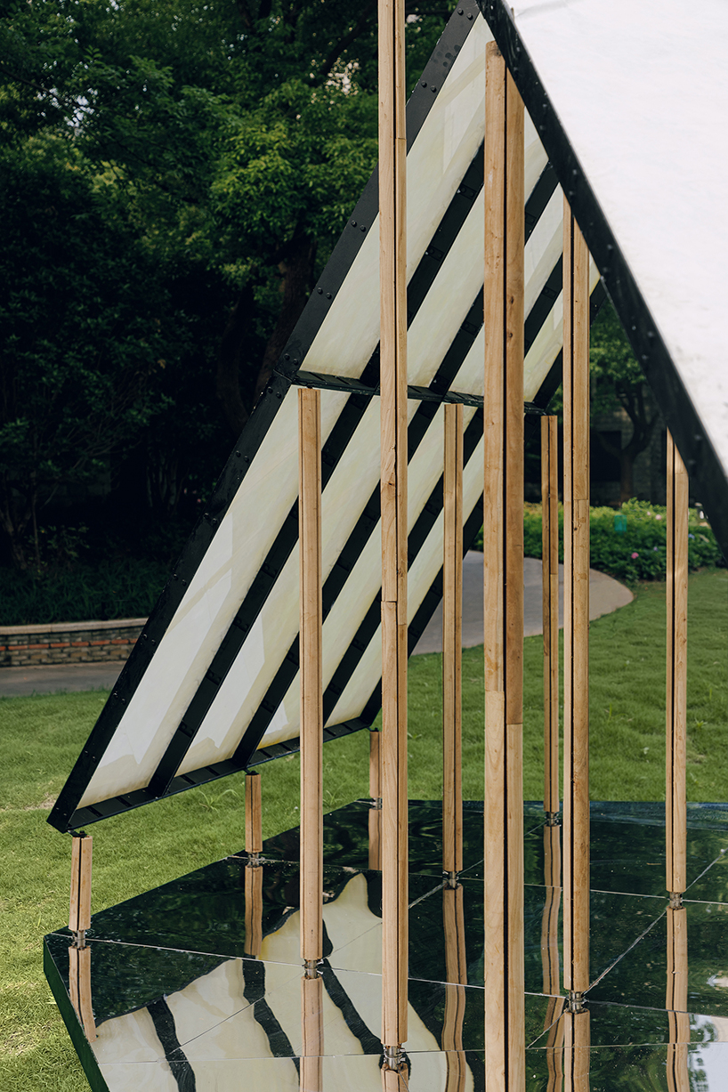 translucent panels of galaxy arch's installation cast warm glow across park in china