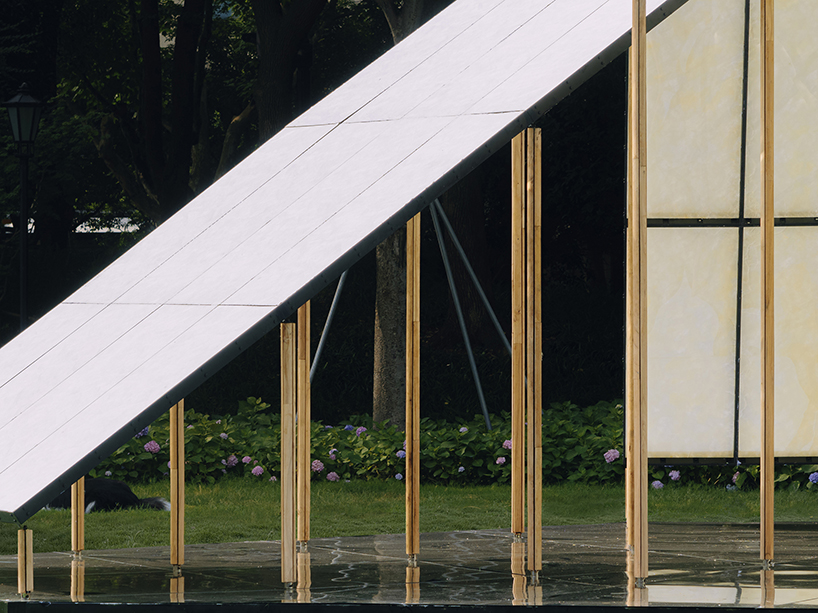 translucent panels of galaxy arch's installation cast warm glow across park in china