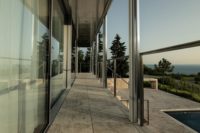 reflective aluminum framework crowns the clifftop house by KONTEXTUS in hungary