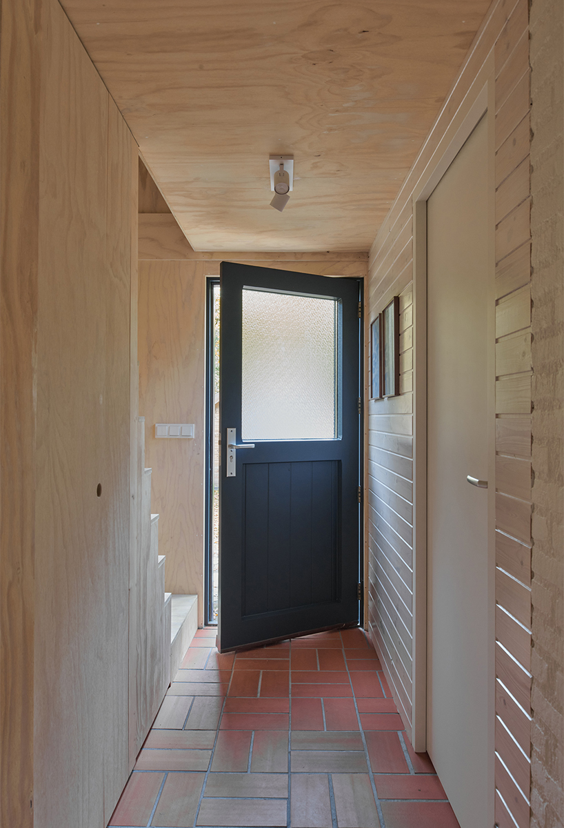 diagonally cut A-frame roof revives dutch holiday home by kumiki